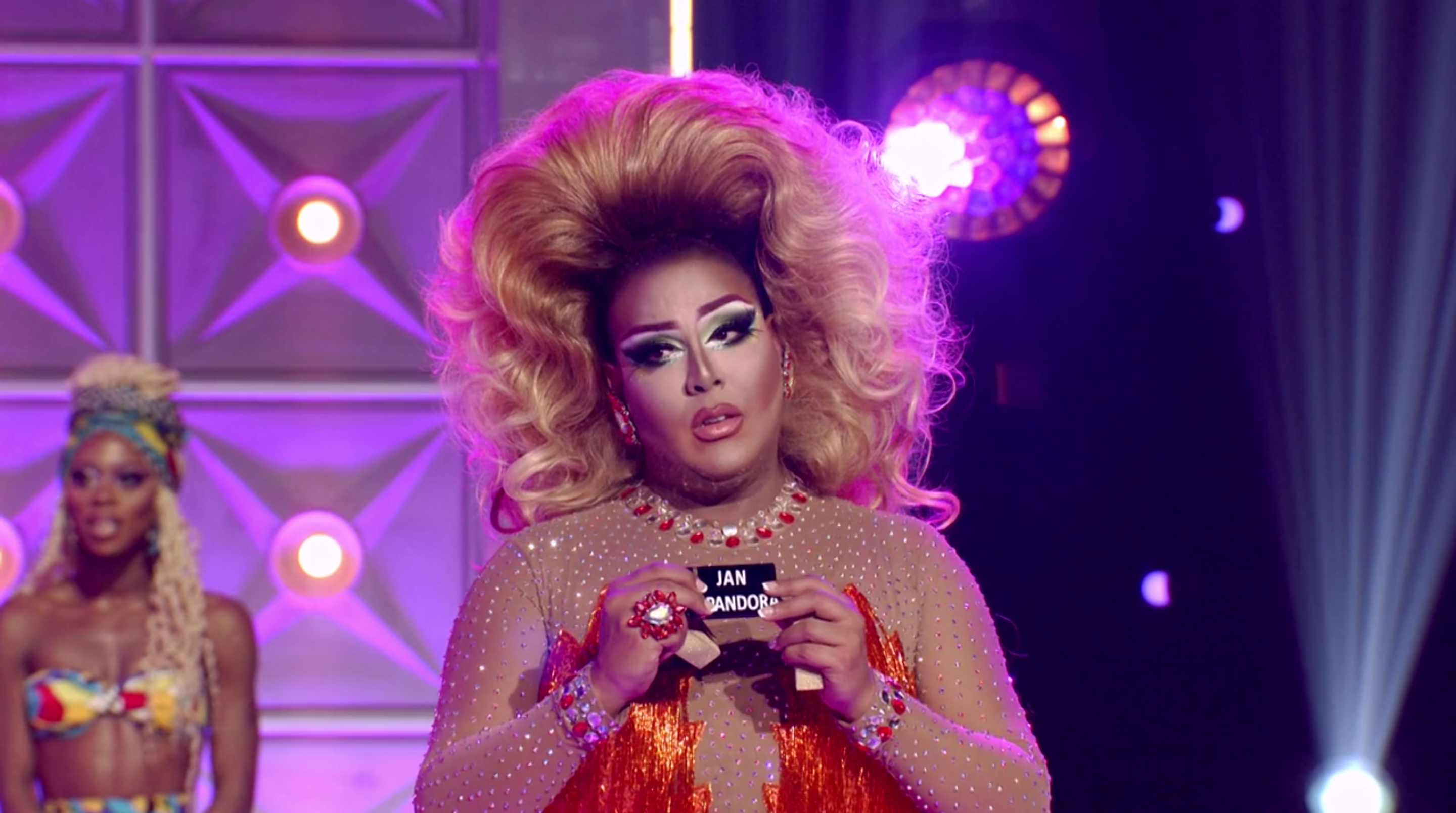 Alexis holding both lipsticks.